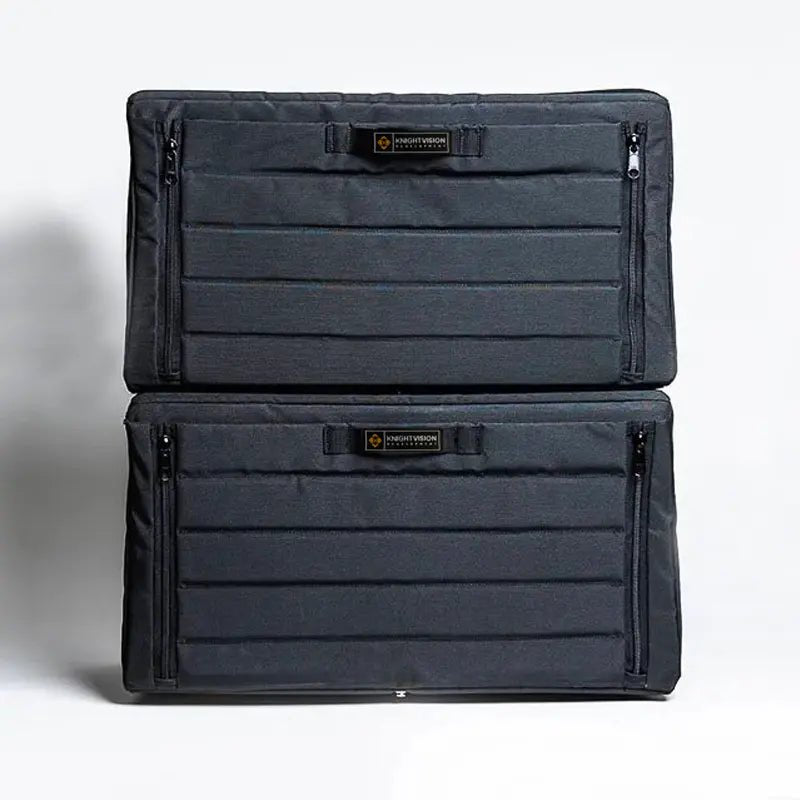 Two black soft-sided van cabinets stacked vertically with zippered closures visible on both sides