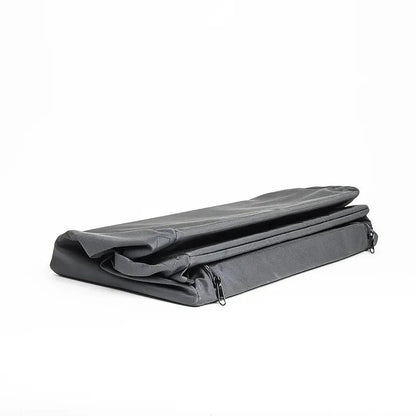 Collapsed soft-sided van cabinet lying flat with zippers on both ends visible.