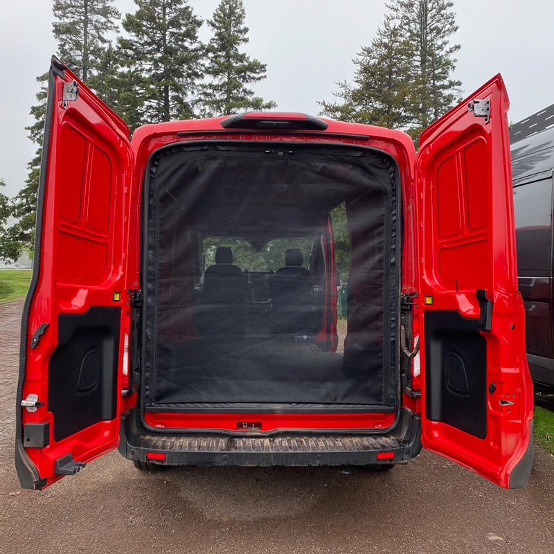 Rear view of a red camper van with doors open and mesh screen covering the back.