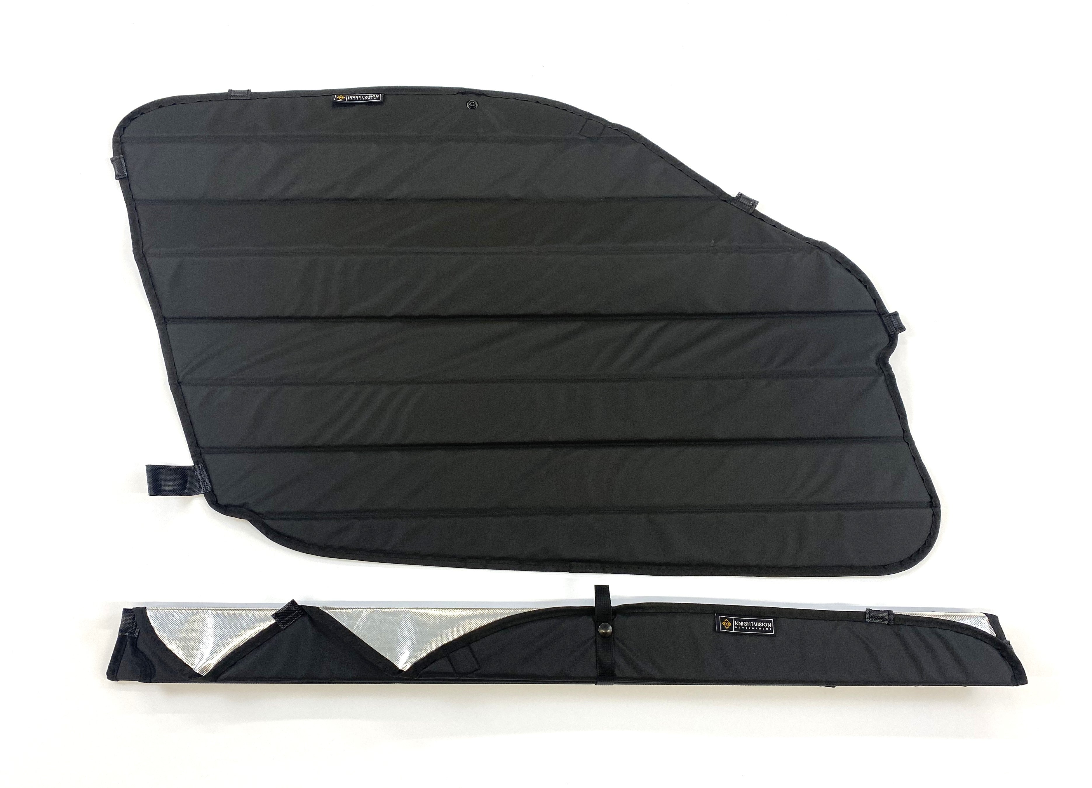 Black quilted window cover with multiple attachment loops, shown fully open and rolled with branded storage strap.