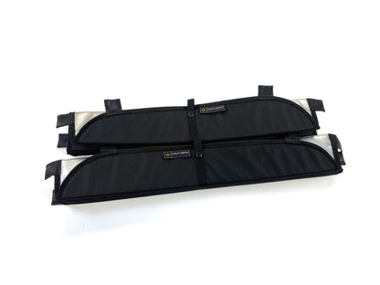 Two folded black window covers with exposed silver insulation edges and Knight Vision branding visible