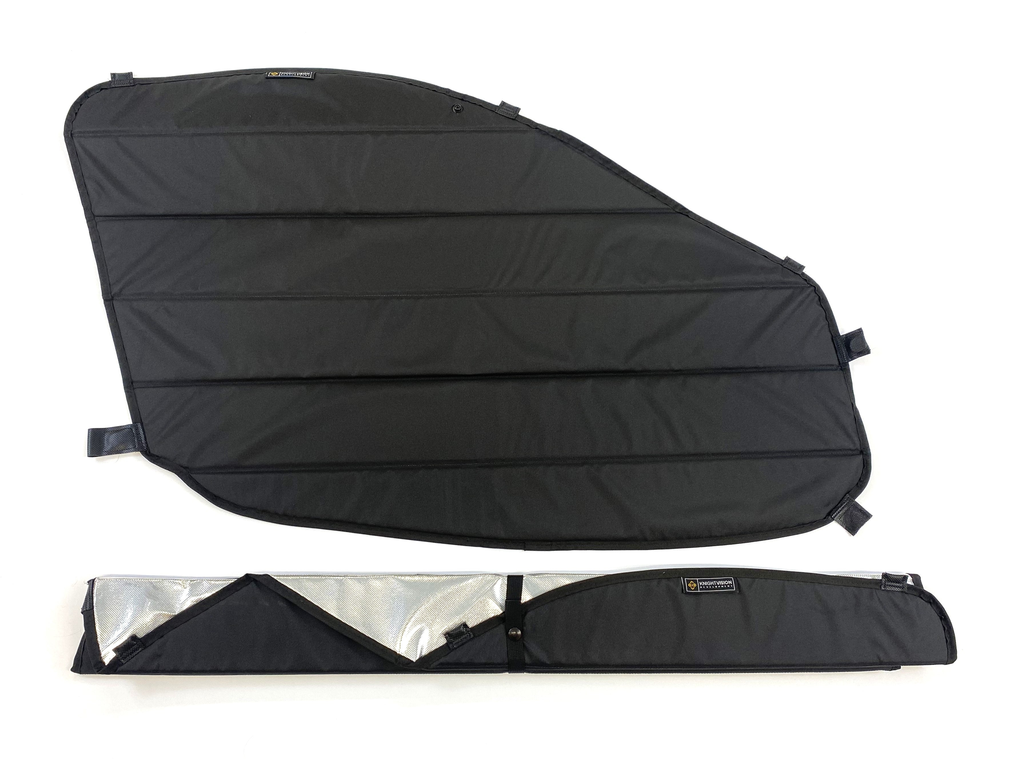 One unfolded black insulated window cover and one folded with reflective interior partially visible