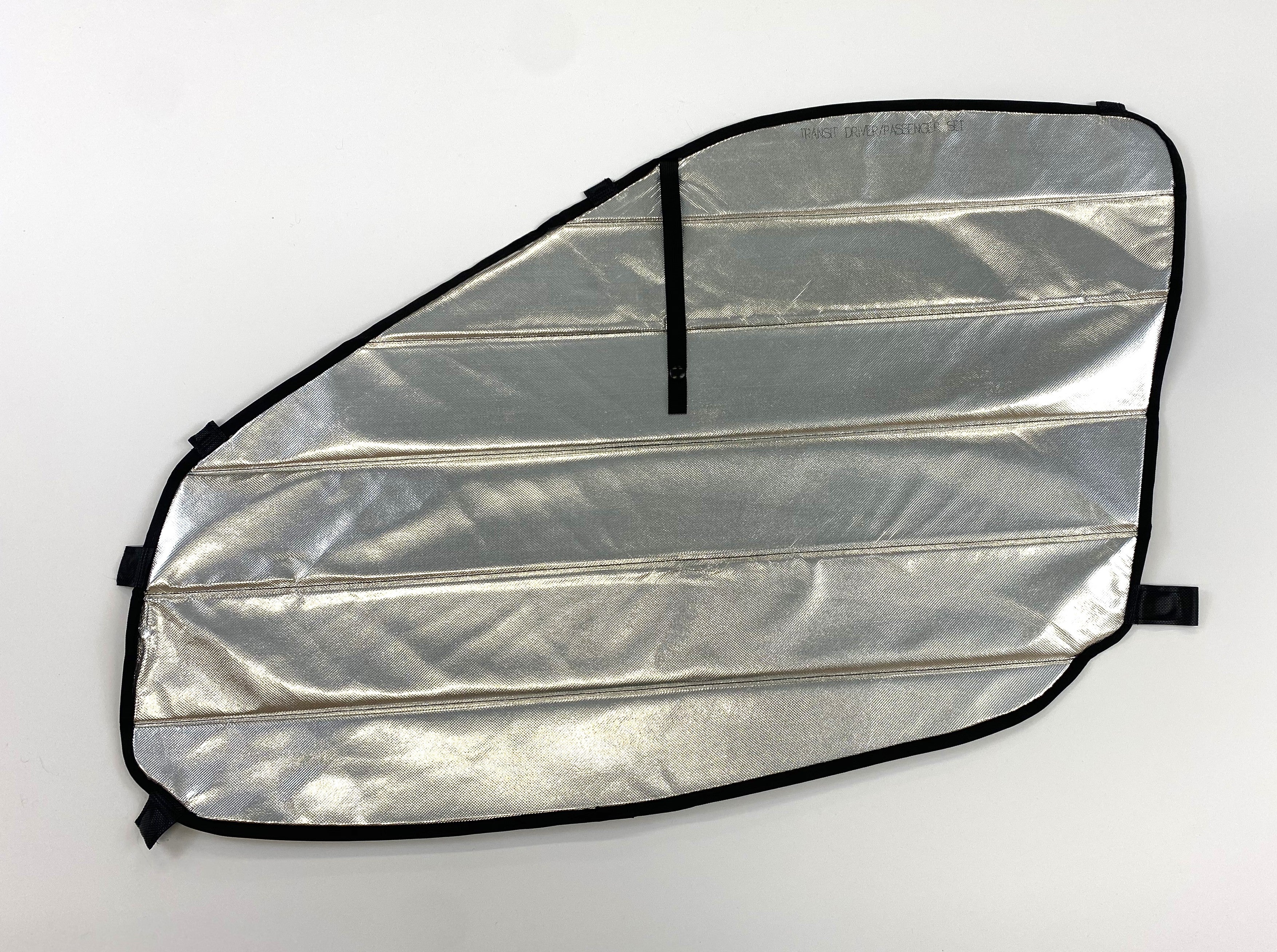 Reflective insulated van window cover with black trim and attachment straps on white background
