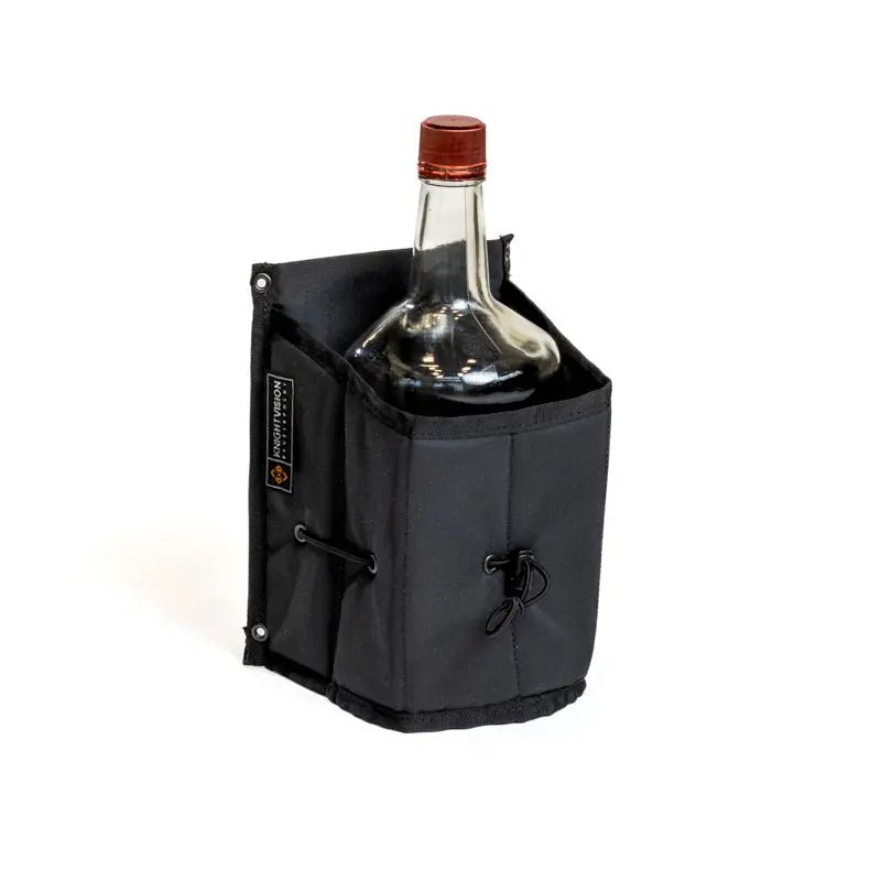 The Growler Cache by Knight Vision Development holding a bottle of Tito’s vodka inside its black fabric pouch.