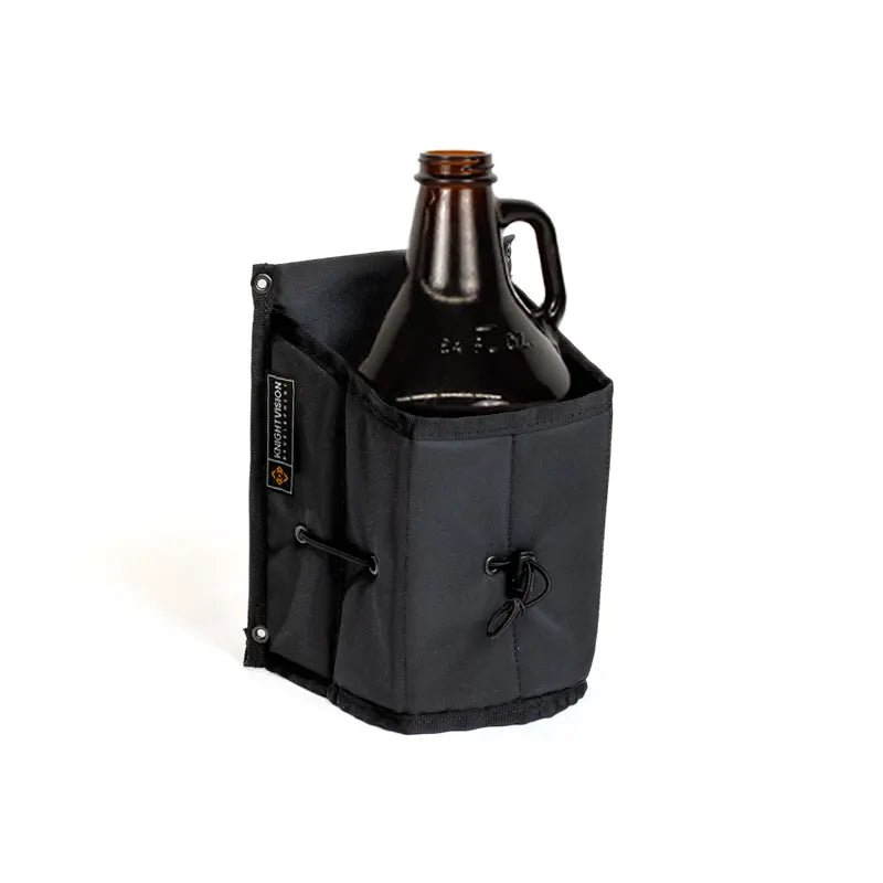The Growler Cache by Knight Vision Development securely holding a brown glass growler in its black fabric holder.