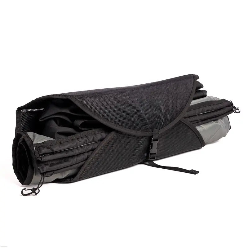The Portable Shower System rolled up in a compact burrito-style for easy storage.